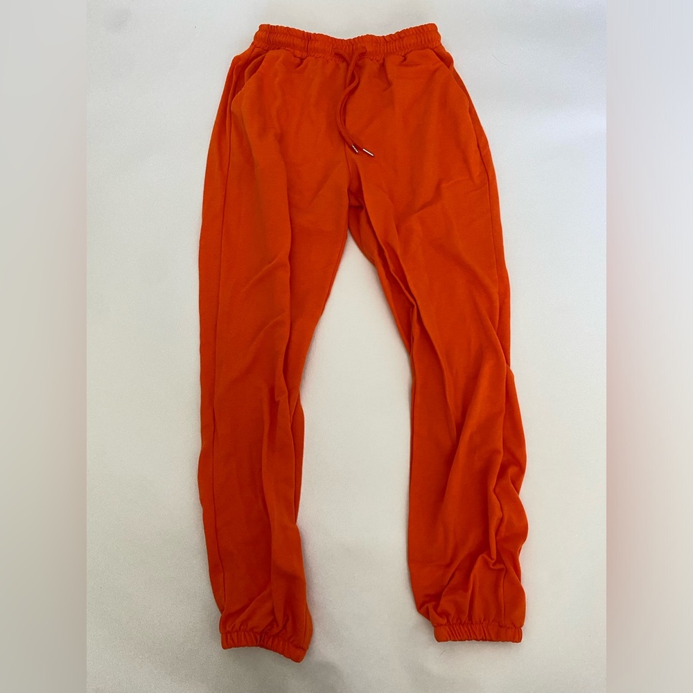 orange cuffed high-waisted sweatpants